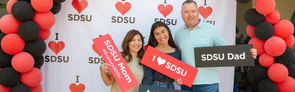 Family on campus at Explore photo booth.