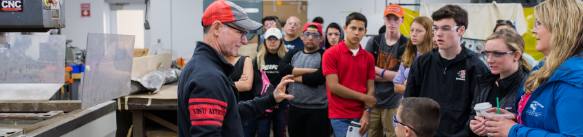 Professor giving a talk to prospective students.