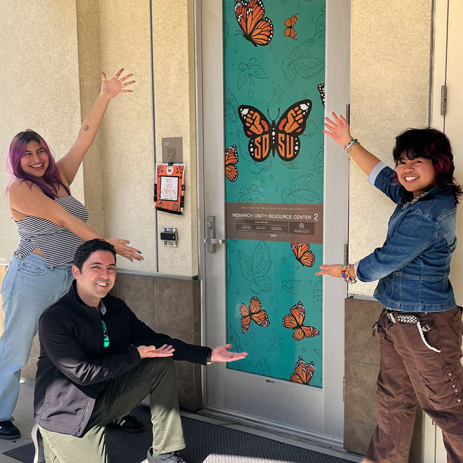Students in front of the Monarch Unity Resource Center butterfly door.