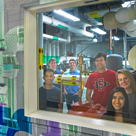 Group of students touring a lab.
