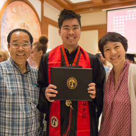 Weber Honors College graduate with family.